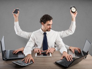 Businessman stressed by too many tasks works in the office